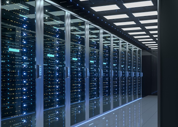 hallway of server racks with lights and glass doors